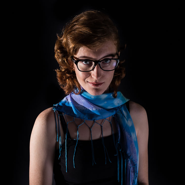 Posed image of redhead with blue scarf